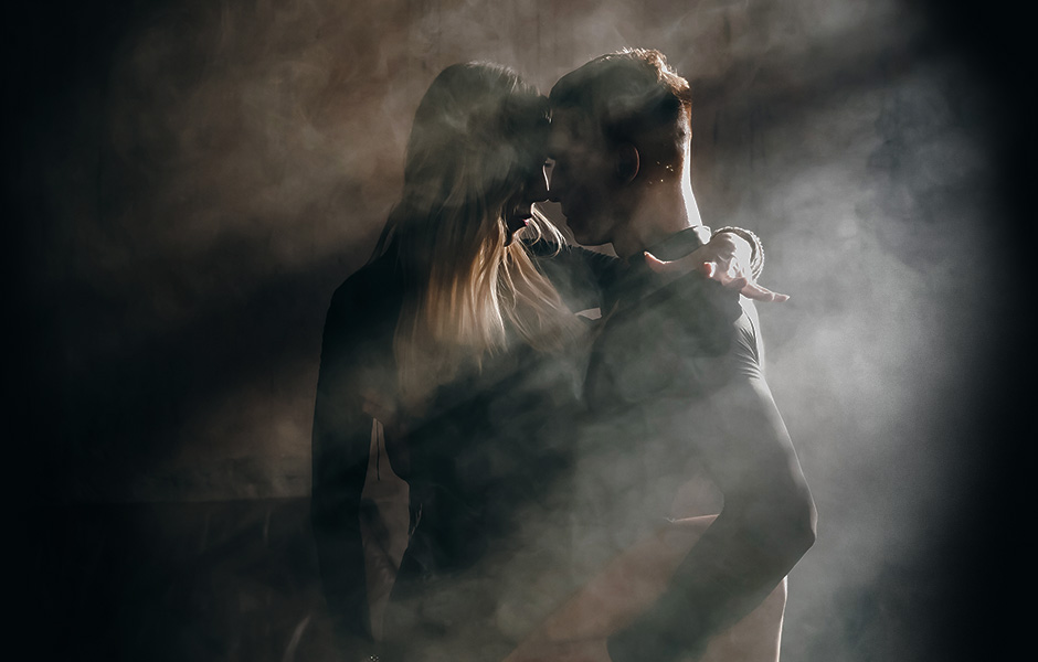 Dance couple close embrace with smokey environment