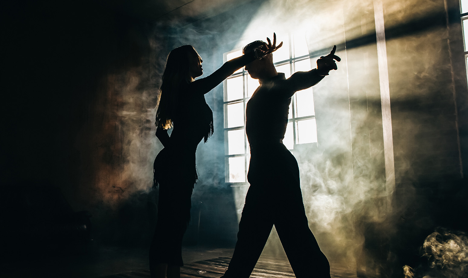 couple dance with outstretched arm towards the camera