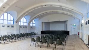 Central glasgow community hall interior with chairs organised